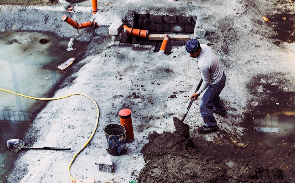 Plumber inspecting old pipes in colonial-era Salem home